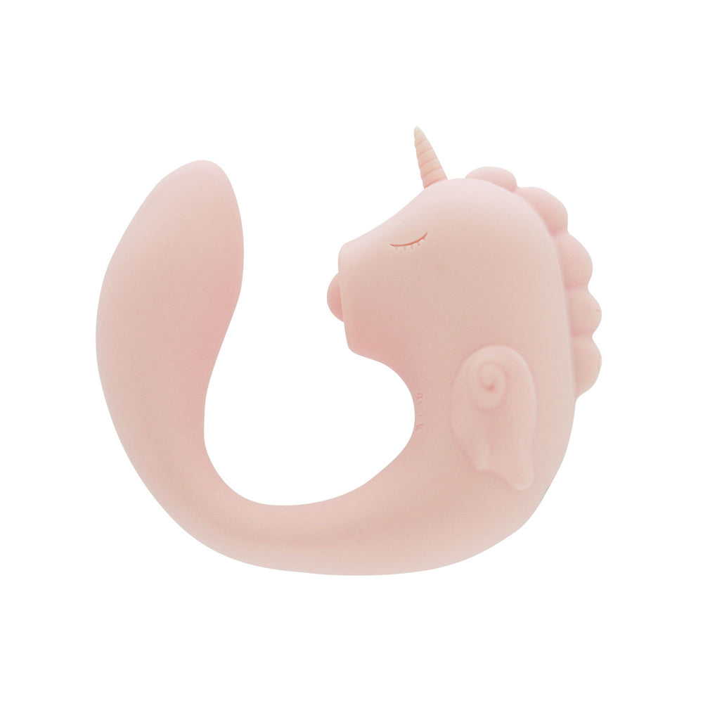 A pink unicorn-shaped silicone massager with a curved tail.