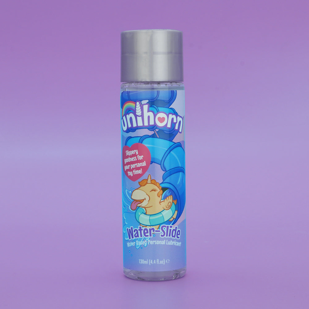 A bottle of Unihorn Water-Slide personal lubricant with a unicorn on a water slide.
