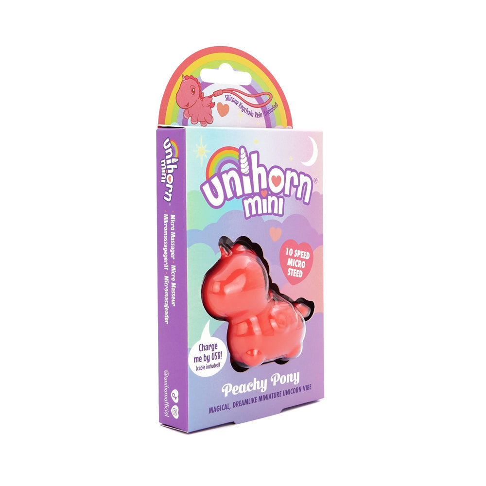 A red unicorn-shaped mini vibrator in its packaging.