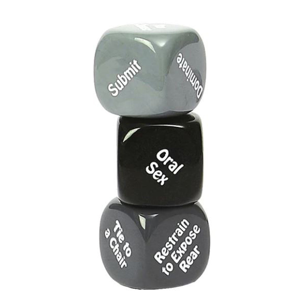 Three stacked dice with words like "Submit," "Dominant," and "Oral Sex" printed on them.