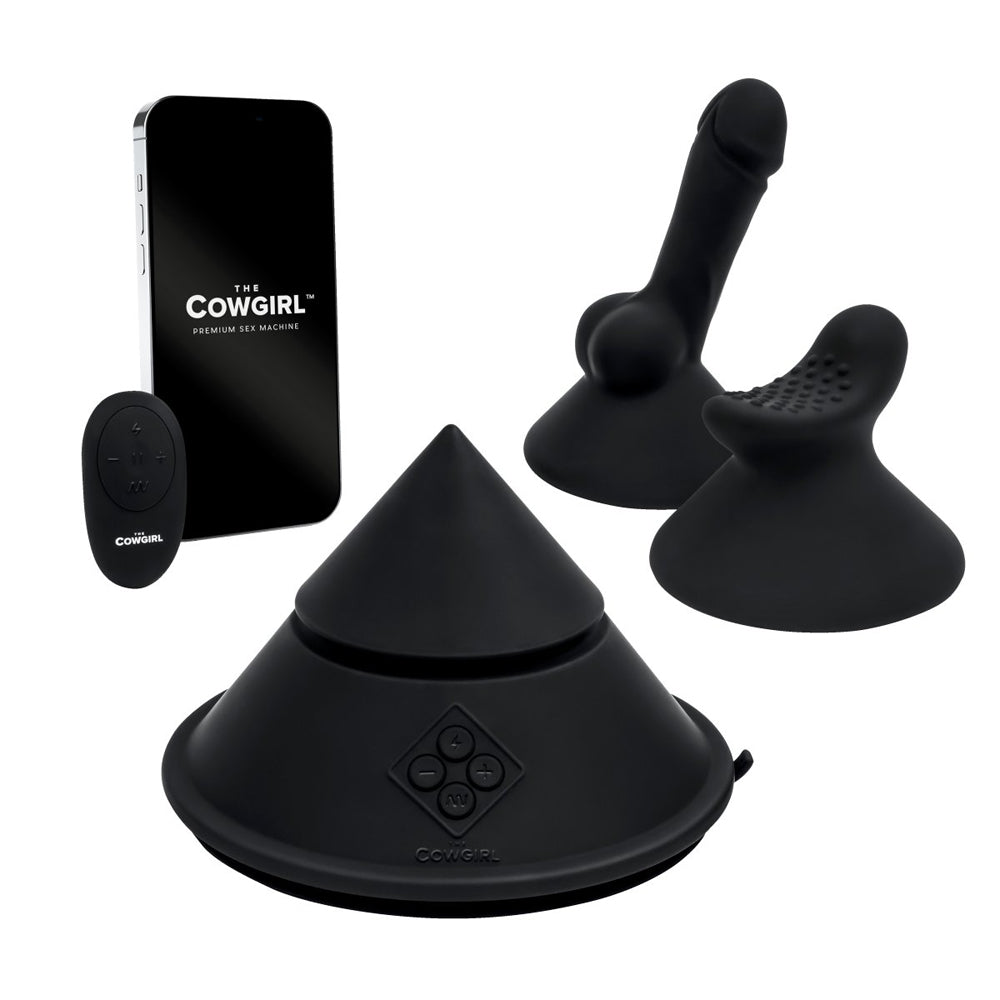 Black silicone sex machine with cone, penis, and clitoral attachments, and a remote.