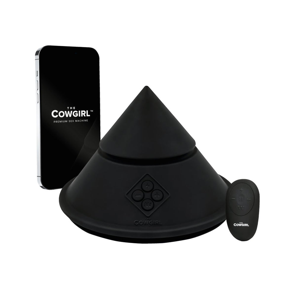 Black cone-shaped sex machine with remote and phone.