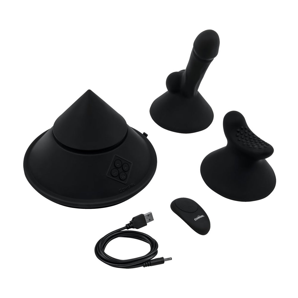 Black silicone sex machine with cone, attachments, remote, and USB cable.
