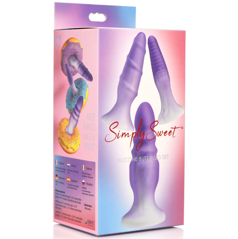 Three textured purple silicone butt plugs with a suction base on a box.