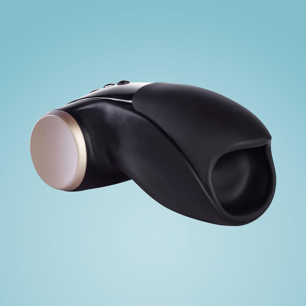Black vibrating masturbator with a gold accent.