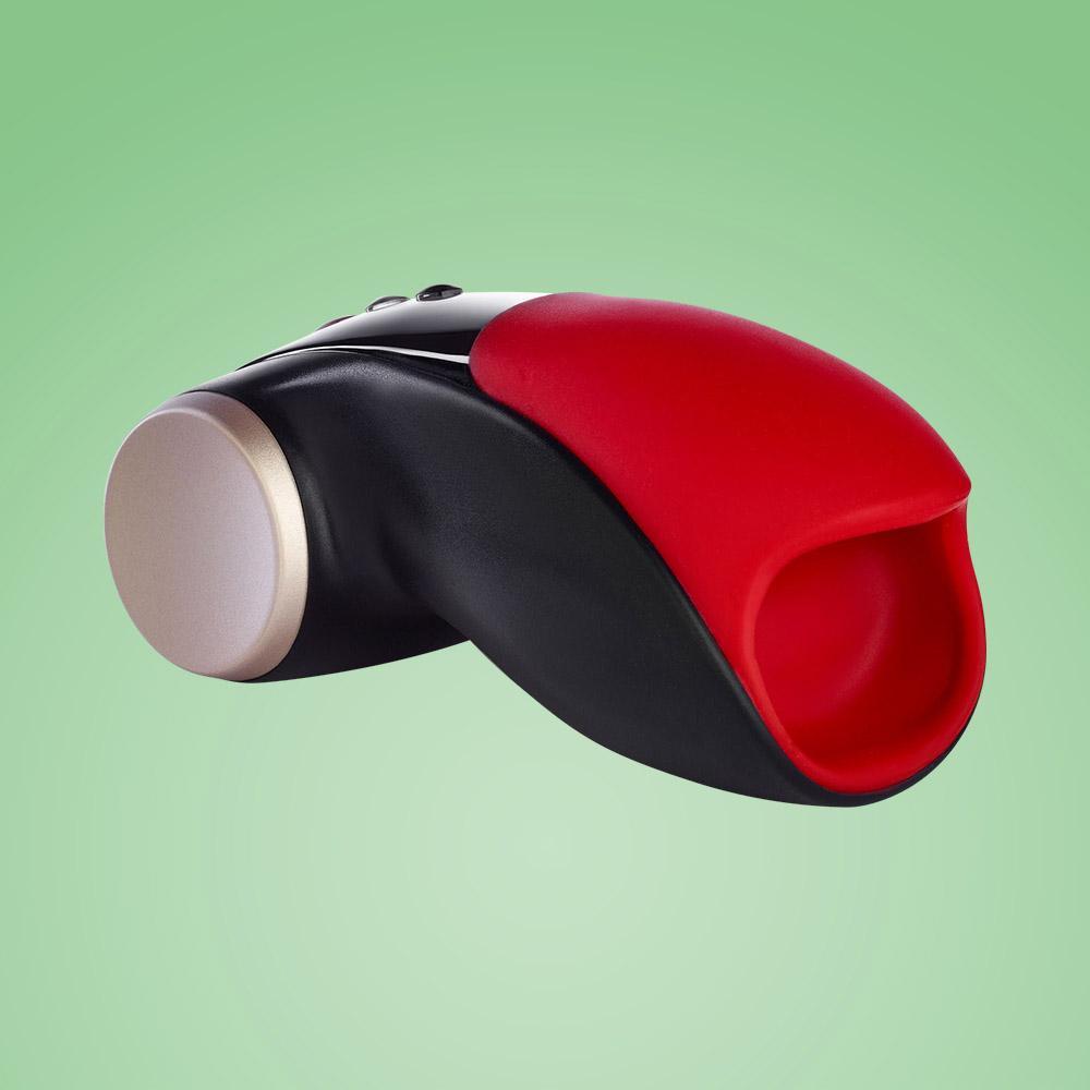 Black and red vibrating masturbator with a gold cap.