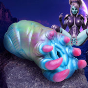 Textured alien-shaped silicone stroker in blue, green, and pink.