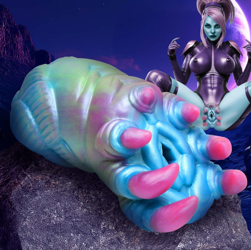 Textured alien-shaped silicone stroker in blue, green, and pink.