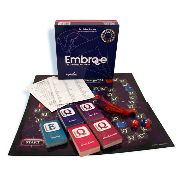 Embrace relationship board game with cards, dice, and a red feather tickler.