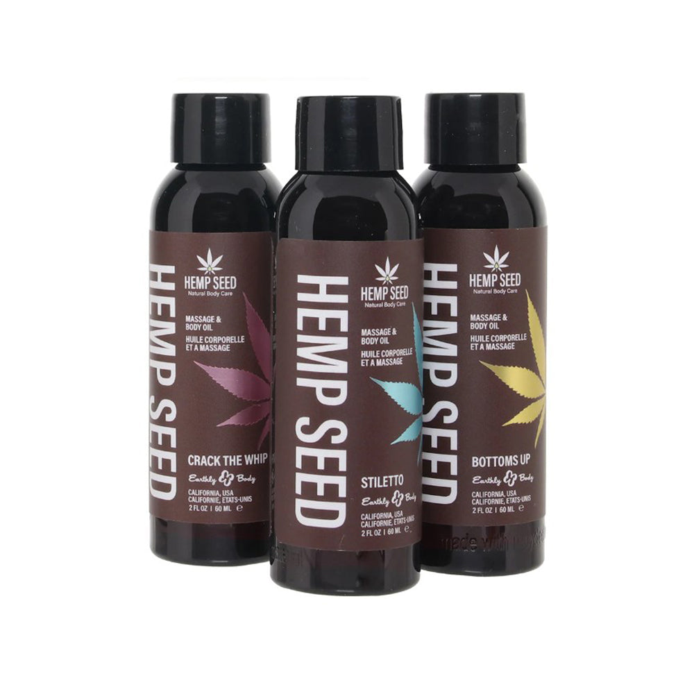 Three bottles of Hemp Seed massage oil with different colored leaf designs.