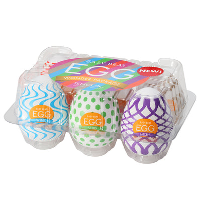 A package of three Tenga EGG masturbator sleeves with different textures and colors.