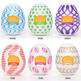 Six Tenga Egg masturbators with different textures and colors.
