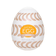 Tenga EGG Ring textured male masturbator sleeve with gold circular patterns.