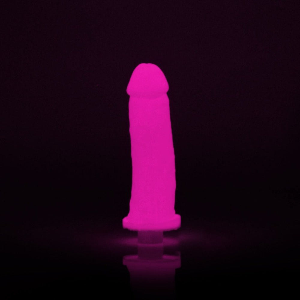 Pink glow-in-the-dark silicone dildo casting kit with molding tube and vibrator.