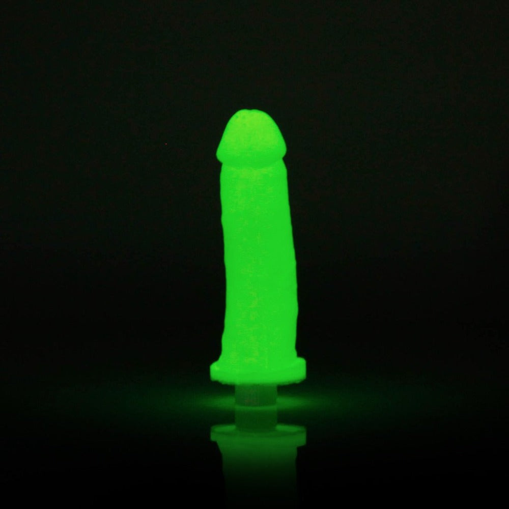 Glow-in-the-dark silicone dildo casting kit with molding tube and vibrator.