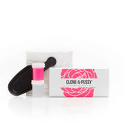 Vagina casting kit with hot pink silicone and molding supplies.