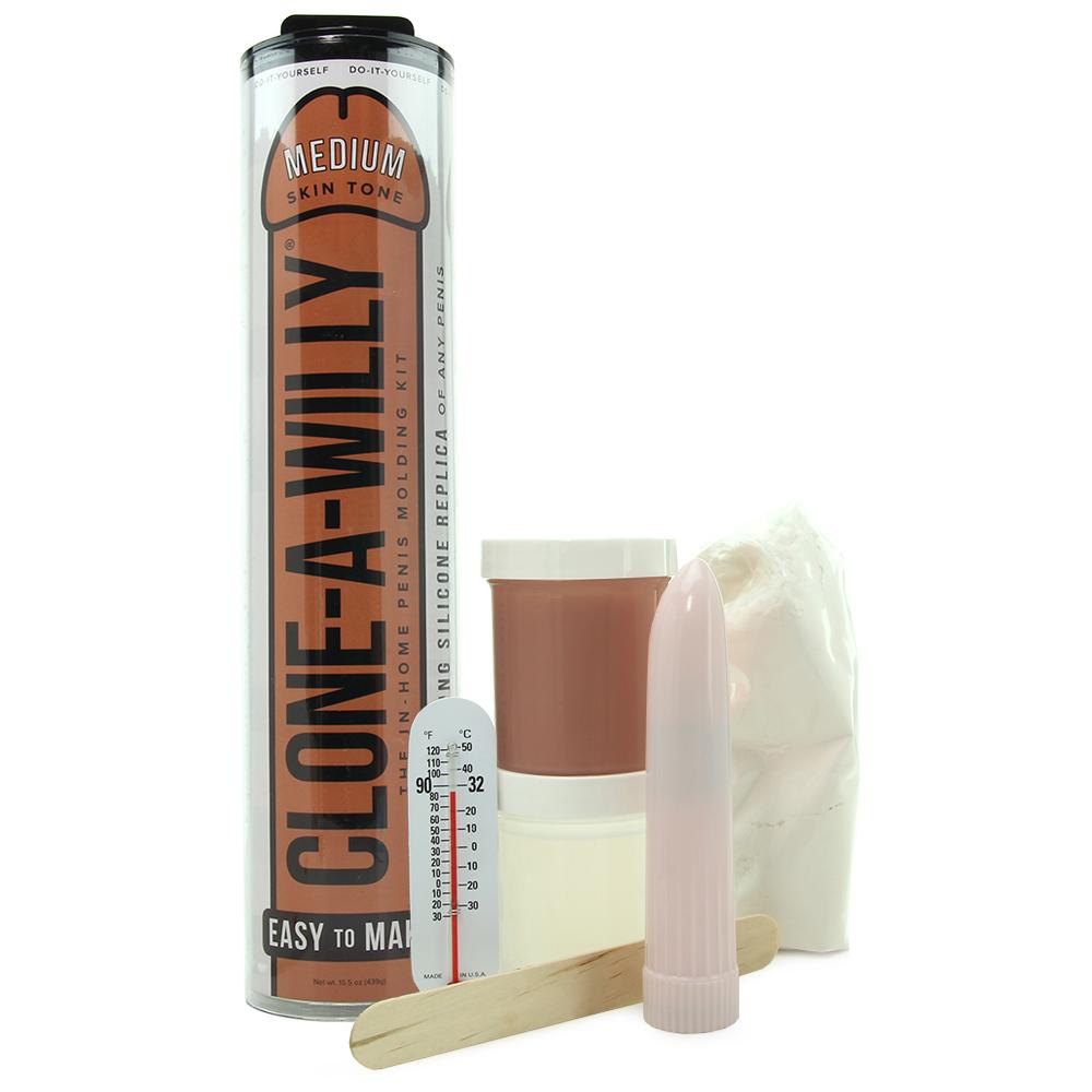 Clone-A-Willy DIY kit with medium skin tone silicone, molding powder, and vibrator.