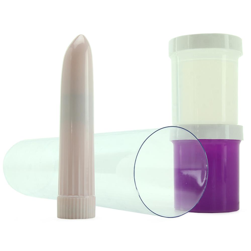 A pink vibrator and two containers of casting material in a clear tube.