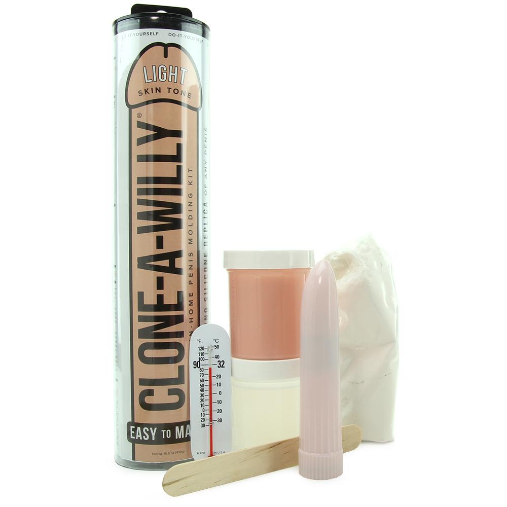 Clone-A-Willy DIY kit with light skin tone silicone, molding supplies, and a vibrator.