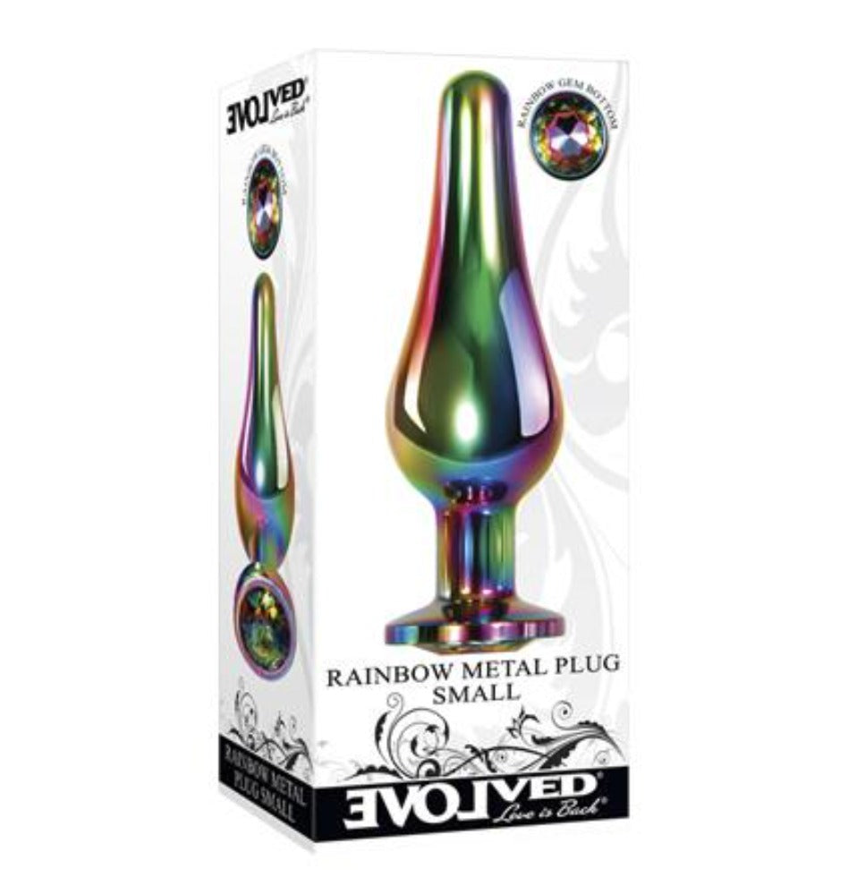 Small rainbow metal anal plug with gem on packaging.