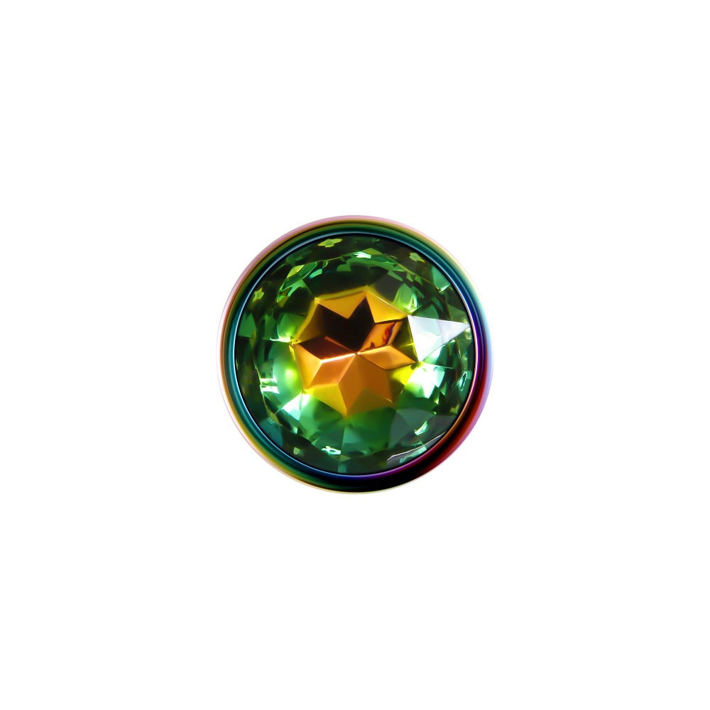 Small rainbow metal anal plug with a faceted green and yellow gem.