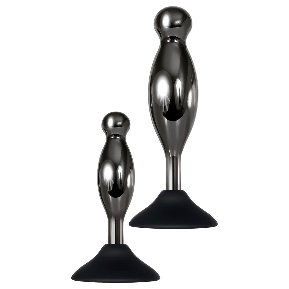Two metallic anal plugs with black suction cup bases.