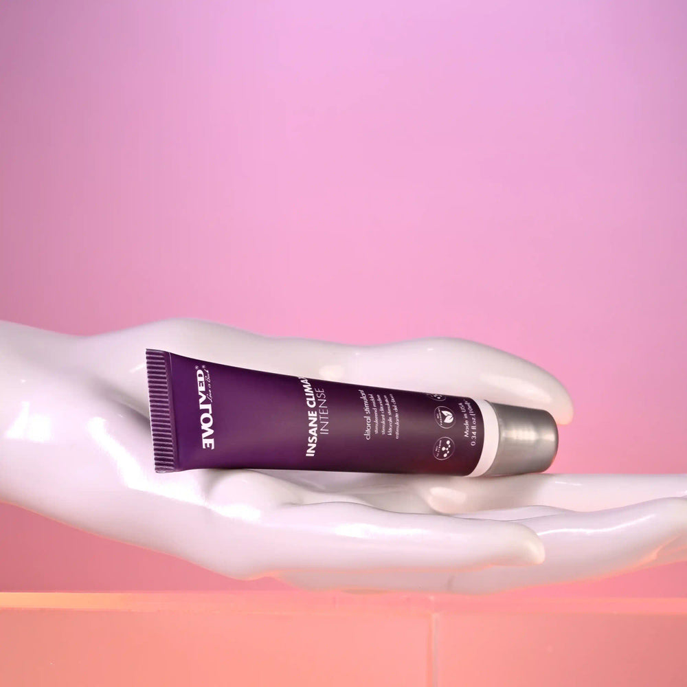 Evolved Novelties Insane Climax Intense clitoral stimulating oil in a purple tube.