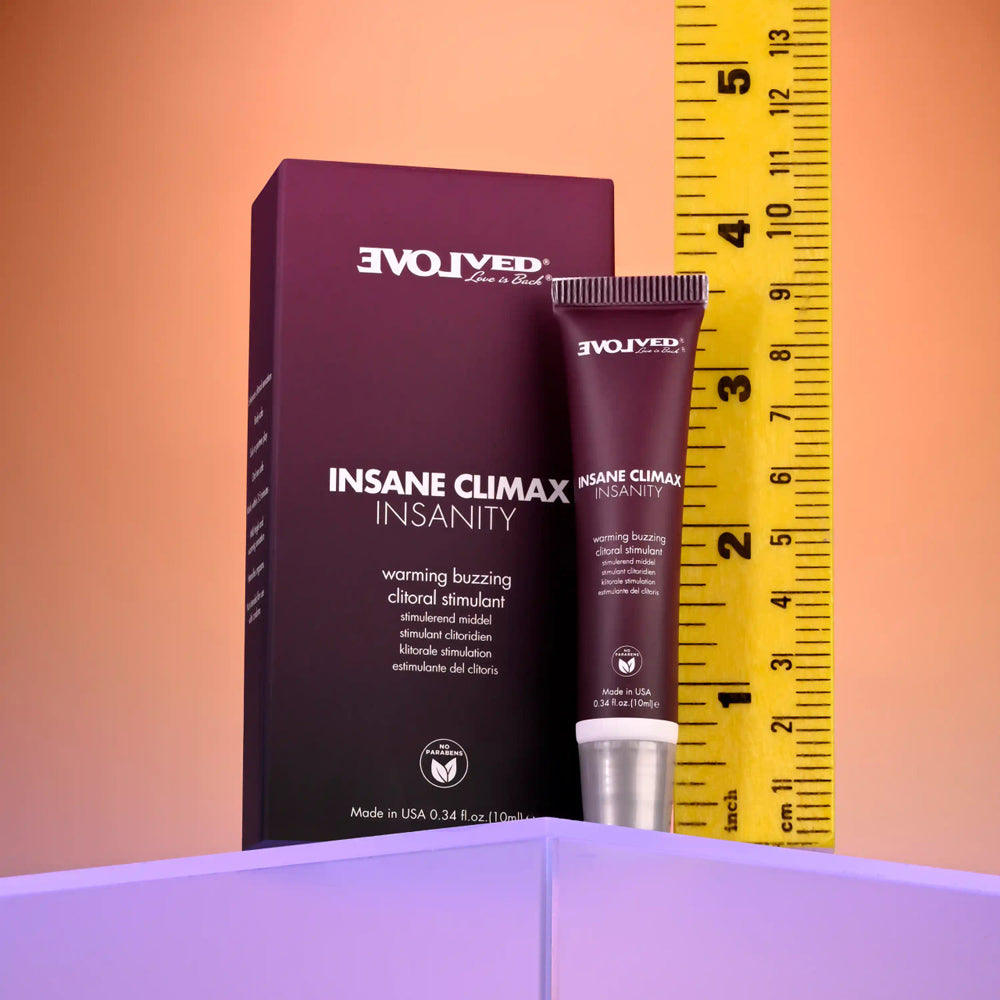 Insanity Warming and Buzzing Climax Gel tube and box next to a ruler.