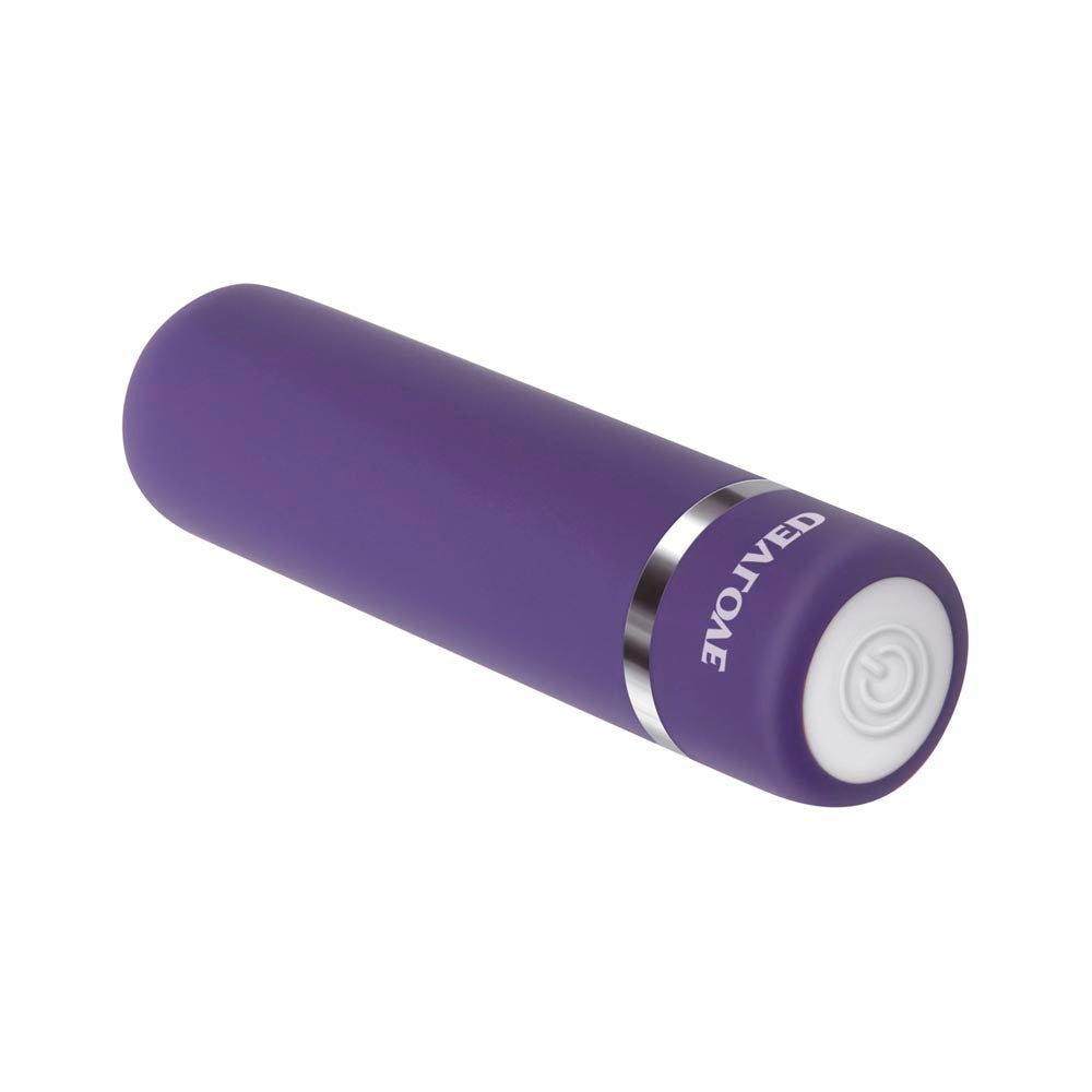 A purple bullet vibrator with a silver band and a white button.