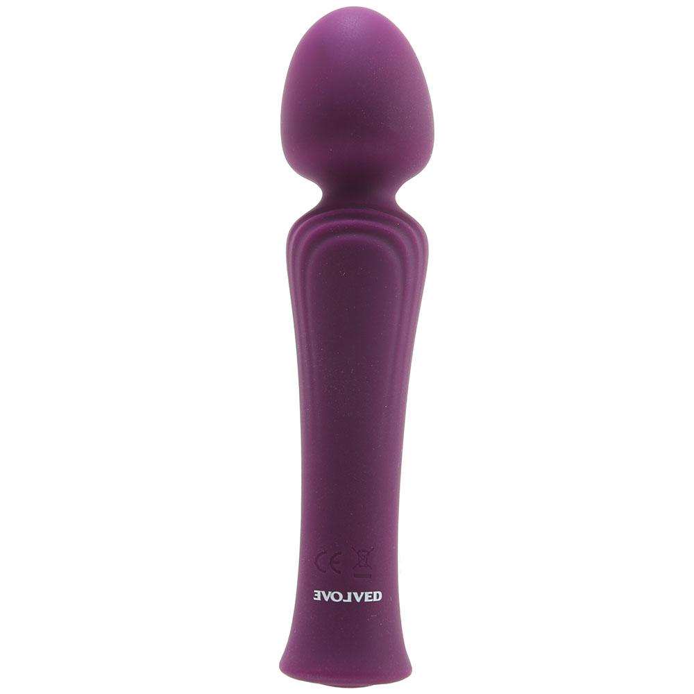 Purple silicone vibrator with a rounded head and ribbed handle.