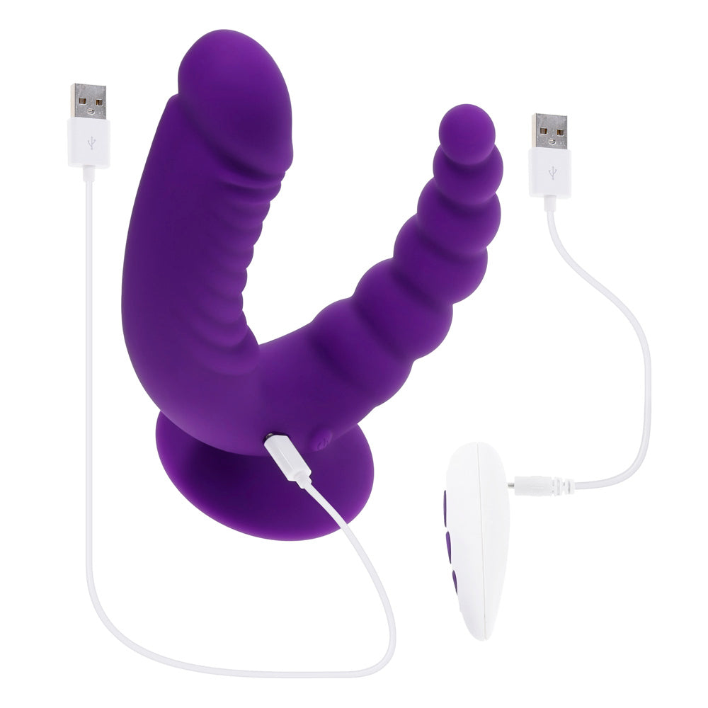 Purple dual stimulating vibrator with textured shafts, suction cup base, remote control, and USB cables.