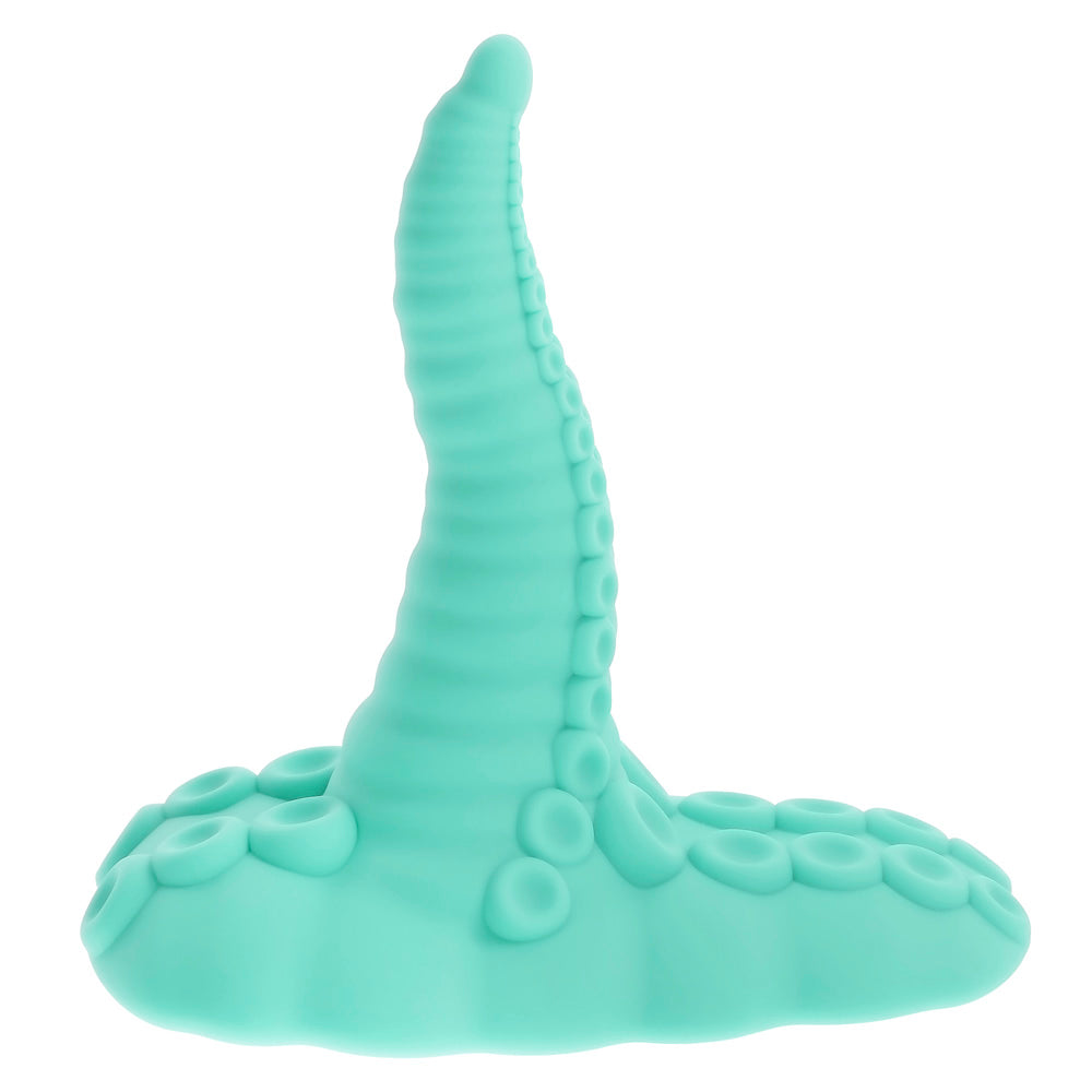 A teal vibrating tentacle grinder with a suction base.