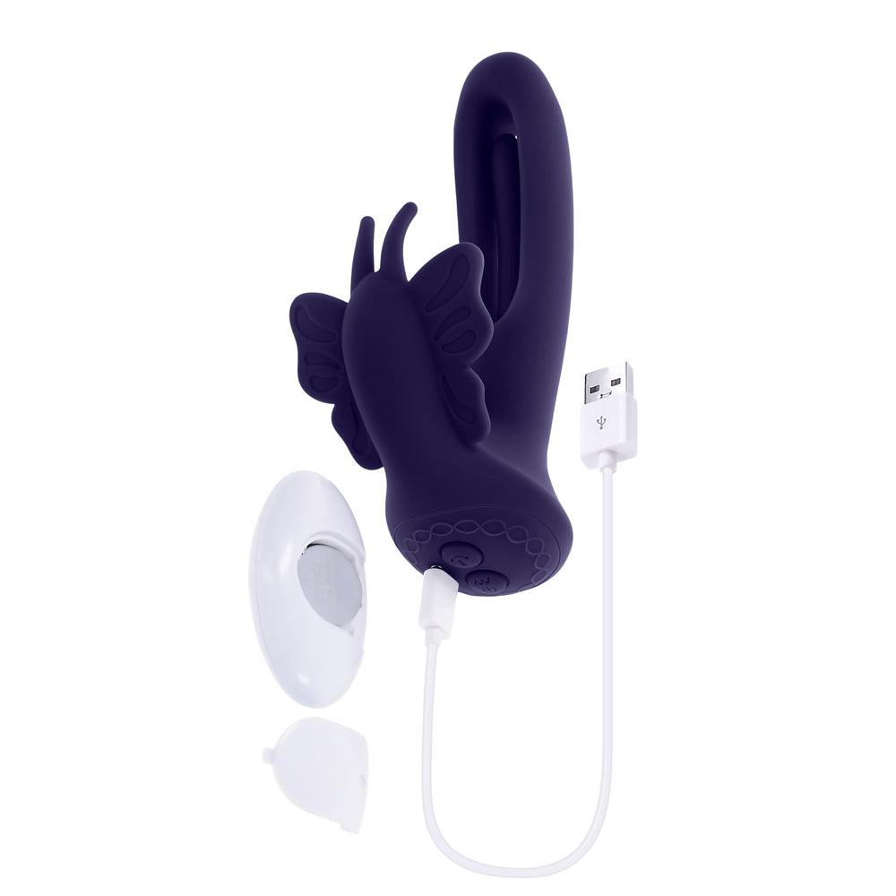 A purple butterfly-shaped stimulator with a USB charging cable and remote.