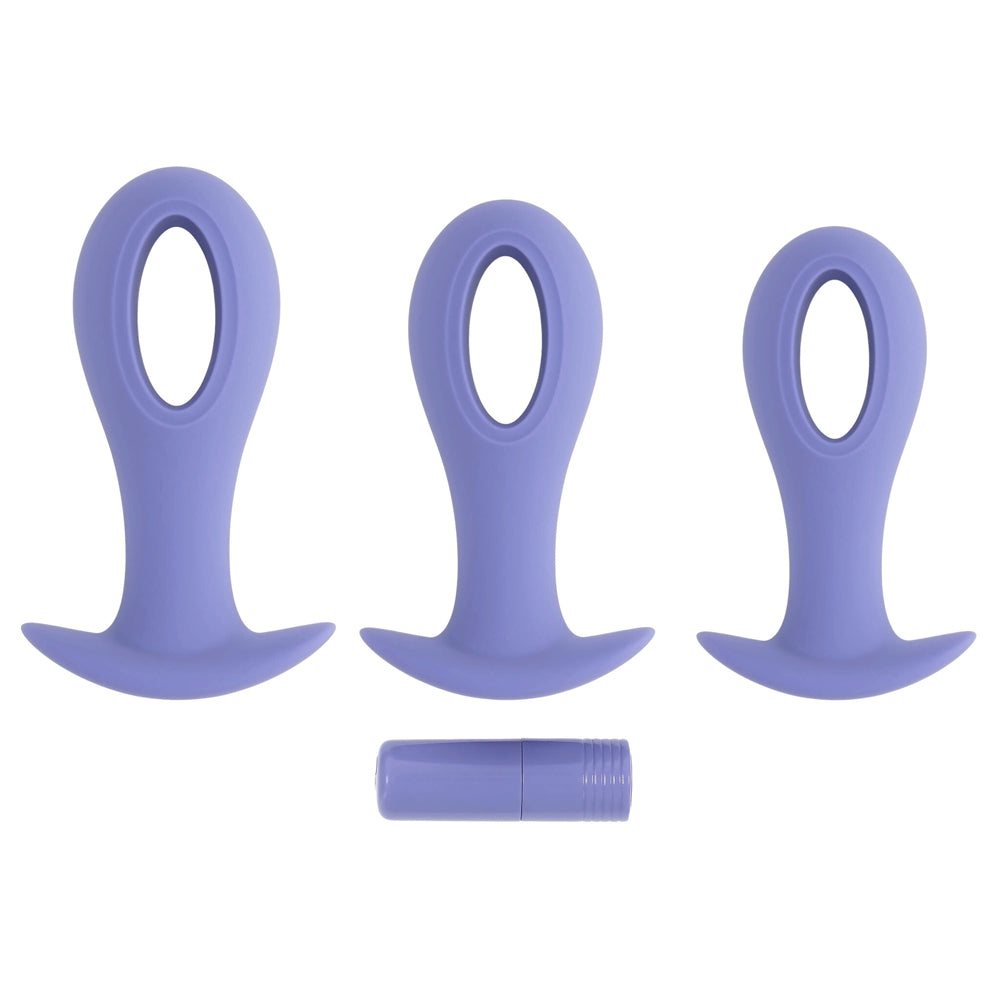 Three purple silicone anal plugs with a hollow center and a small charging cylinder.