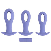 Three purple silicone anal plugs with a hollow center and a small charging cylinder.