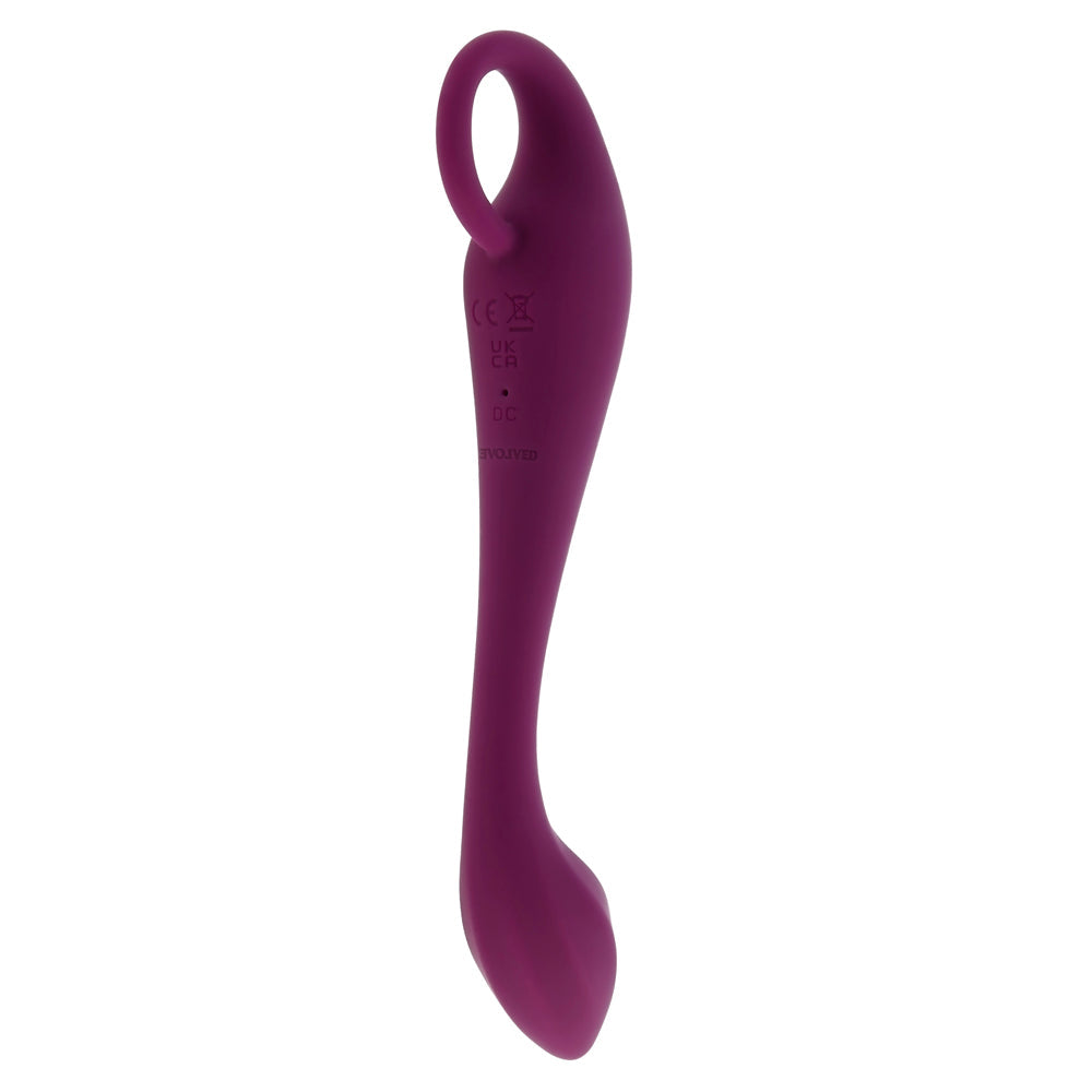 A purple silicone G-spot vibrator with a curved shaft and a loop handle.