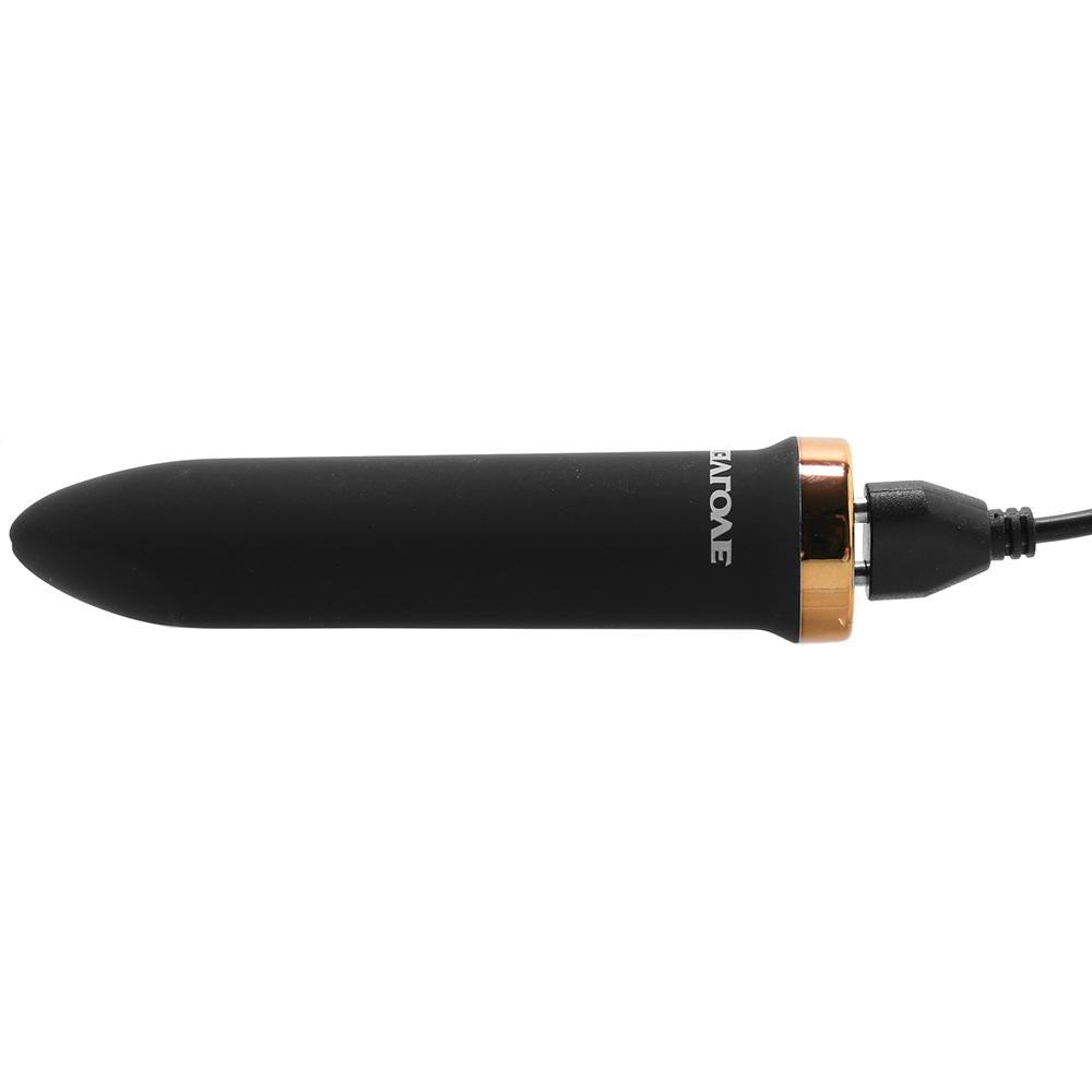 Black vibrating massager with gold accent and USB cable.