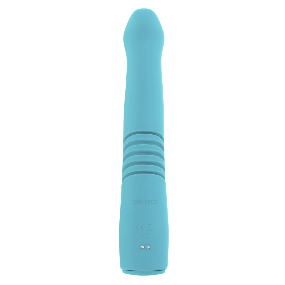 A teal thrusting rabbit vibrator with ribbed detailing and charging ports.