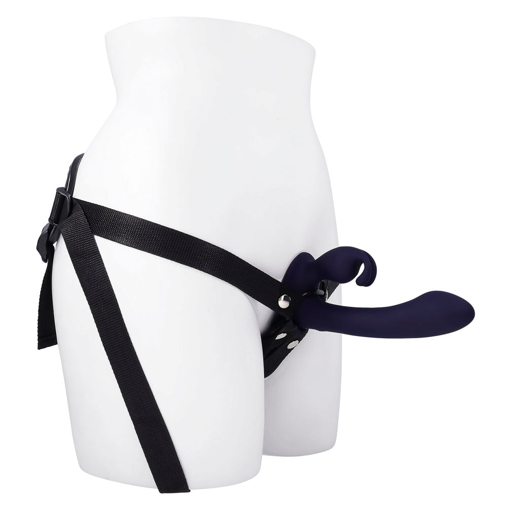 Strap-on harness with a purple rabbit vibrator attached.