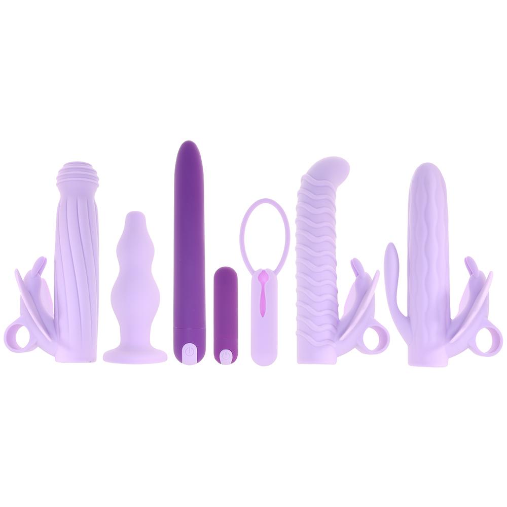 A collection of seven purple silicone sex toys with various textures and shapes.