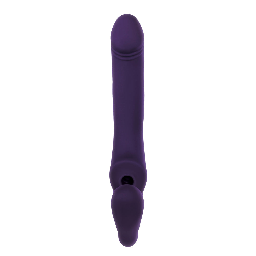 Purple silicone strap-on vibrator with a curved insertable shaft and a suction point.