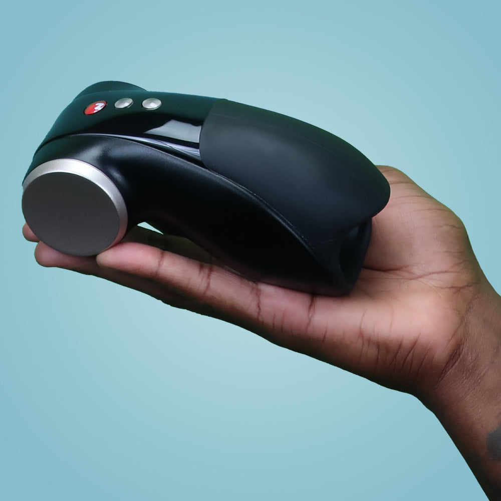 Cobra Libre II vibrating masturbator held in a hand.