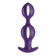 Purple weighted anal plug with inner balls and a flared base.