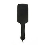 Black leather impact paddle with a wide surface area and handle.