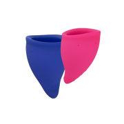 Two reusable menstrual cups, one blue and one pink, are shown against a black background.