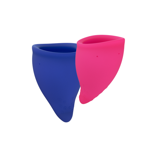 Two reusable menstrual cups, one blue and one pink, are shown against a black background.
