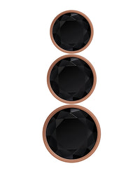 Rose gold metal anal plugs with black jewel bases in three sizes.