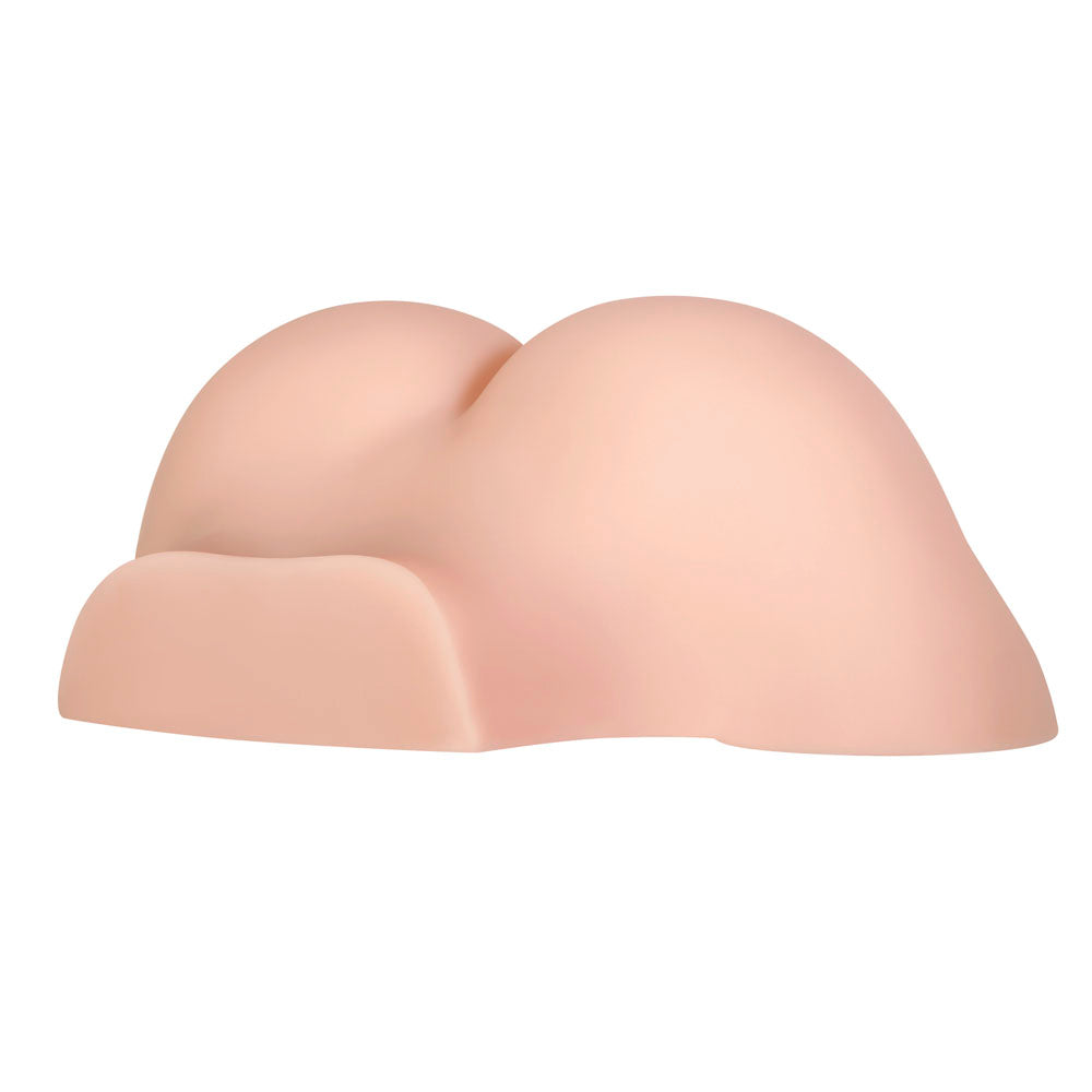 Realistic butt stroker made of pink TPE with a curved shape.
