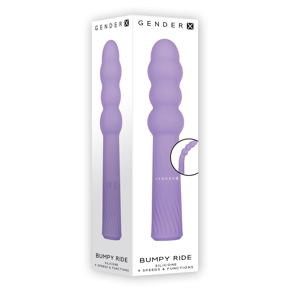 A purple silicone vibrator with ribbed texture on a white box.