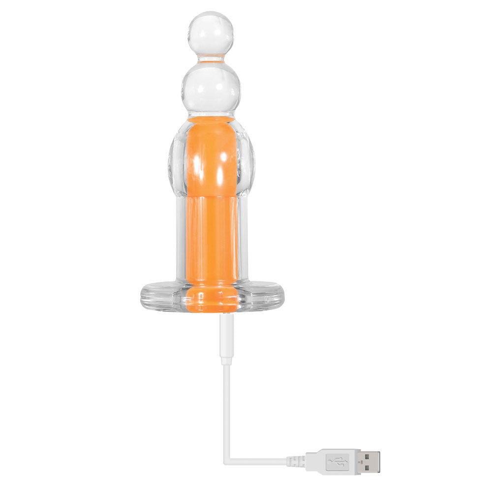 A clear beaded plug with an orange insert and a USB charging cable.